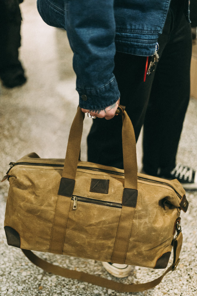Brown canvas duffle bag deals